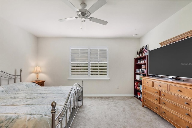 bedroom with light carpet and ceiling fan