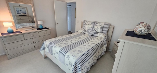 bedroom featuring light colored carpet