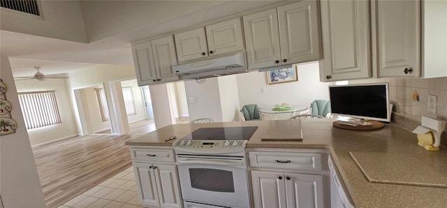 kitchen with ceiling fan, white cabinetry, light tile patterned flooring, and white appliances