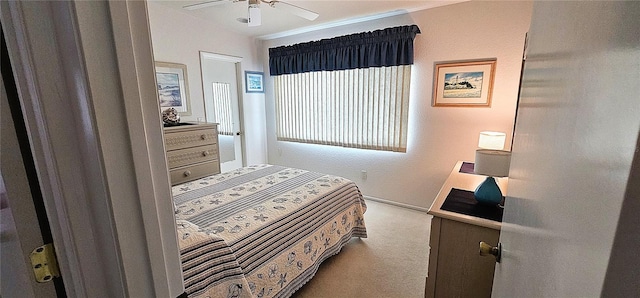 bedroom with light colored carpet and ceiling fan