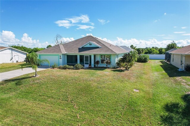 view of front facade featuring a front yard and a garage