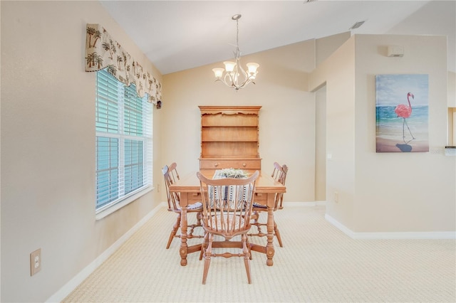 carpeted dining space with vaulted ceiling and a notable chandelier