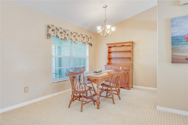 carpeted dining space featuring a chandelier