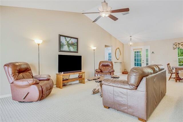 living room featuring light carpet, lofted ceiling, and ceiling fan