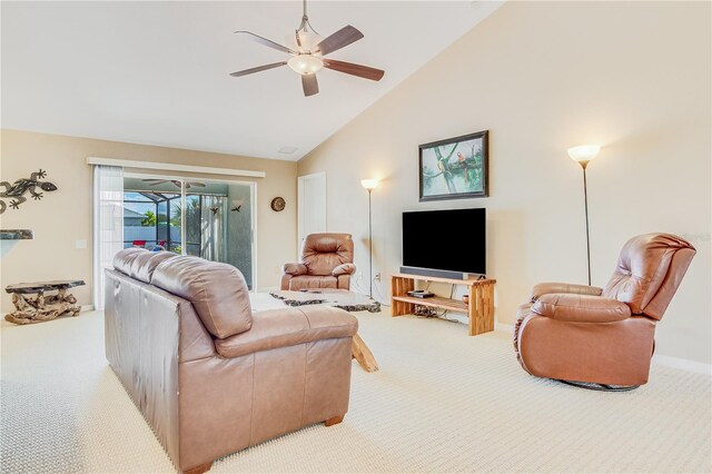 living room featuring high vaulted ceiling, ceiling fan, and light colored carpet