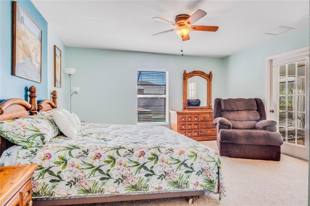 bedroom with ceiling fan, access to exterior, and carpet flooring