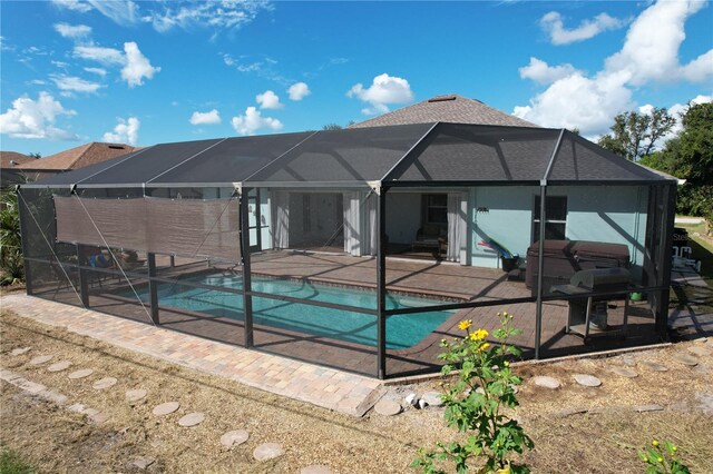 view of pool with a patio and a lanai