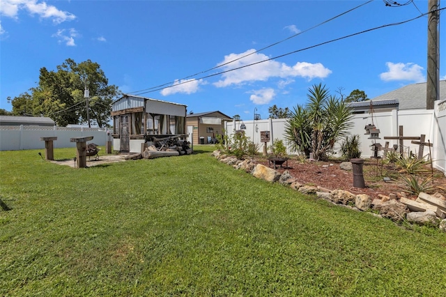 view of yard with a sunroom