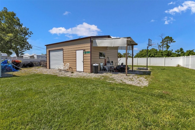 view of outbuilding featuring a yard