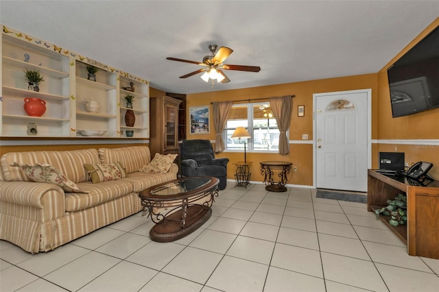 tiled living room featuring ceiling fan