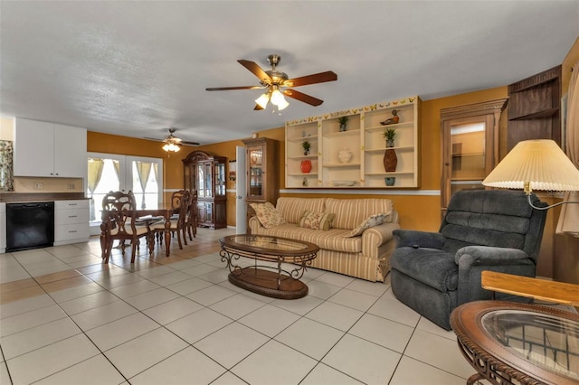 tiled living room featuring ceiling fan