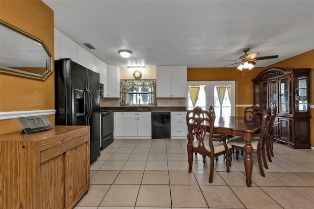 kitchen featuring black appliances, light tile patterned flooring, french doors, ceiling fan, and white cabinets