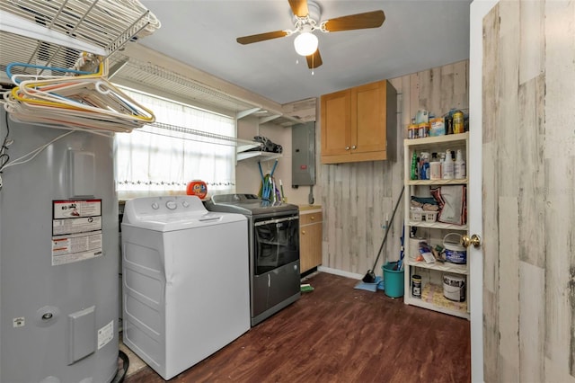 laundry room featuring cabinets, electric panel, independent washer and dryer, dark hardwood / wood-style floors, and water heater