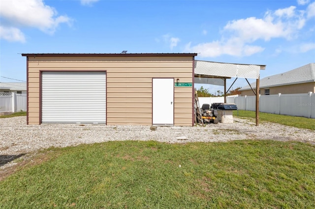 garage with a yard