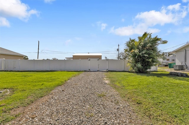 view of yard with central air condition unit