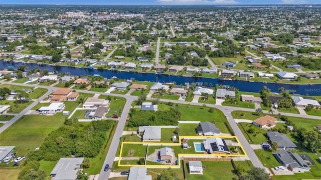 drone / aerial view with a water view