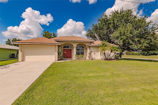 mediterranean / spanish-style house with a front yard and a garage