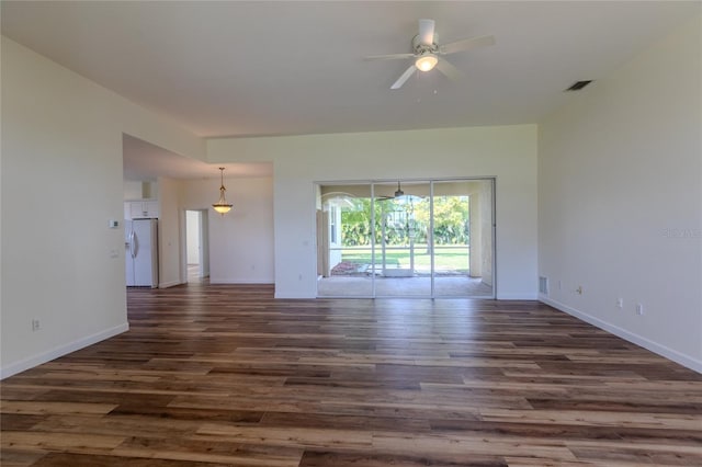 unfurnished living room with ceiling fan and dark wood-type flooring