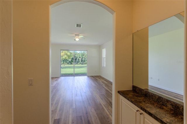 unfurnished room with light hardwood / wood-style flooring and ceiling fan