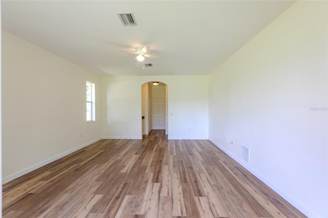 empty room featuring ceiling fan and light hardwood / wood-style flooring