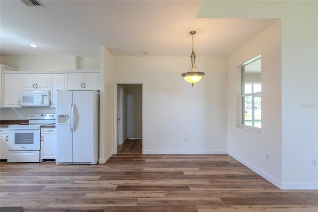 kitchen featuring pendant lighting, white cabinets, white appliances, and light wood-type flooring