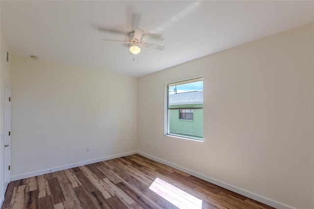 spare room featuring ceiling fan and light hardwood / wood-style flooring