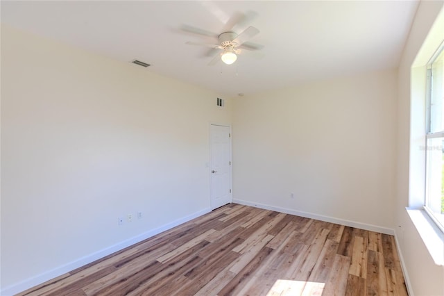 unfurnished room with light hardwood / wood-style floors and ceiling fan