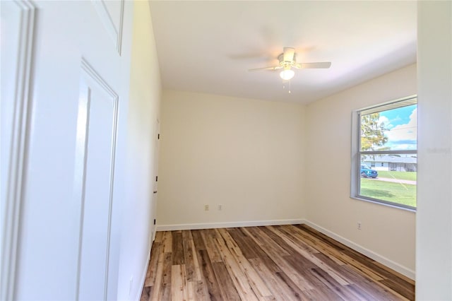 unfurnished room featuring light wood-type flooring and ceiling fan