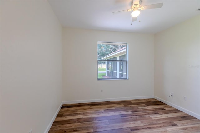 spare room featuring light wood-type flooring and ceiling fan