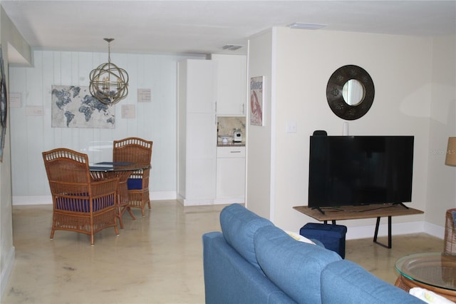 living room featuring a notable chandelier