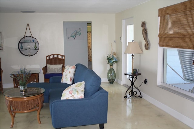 living room with concrete floors