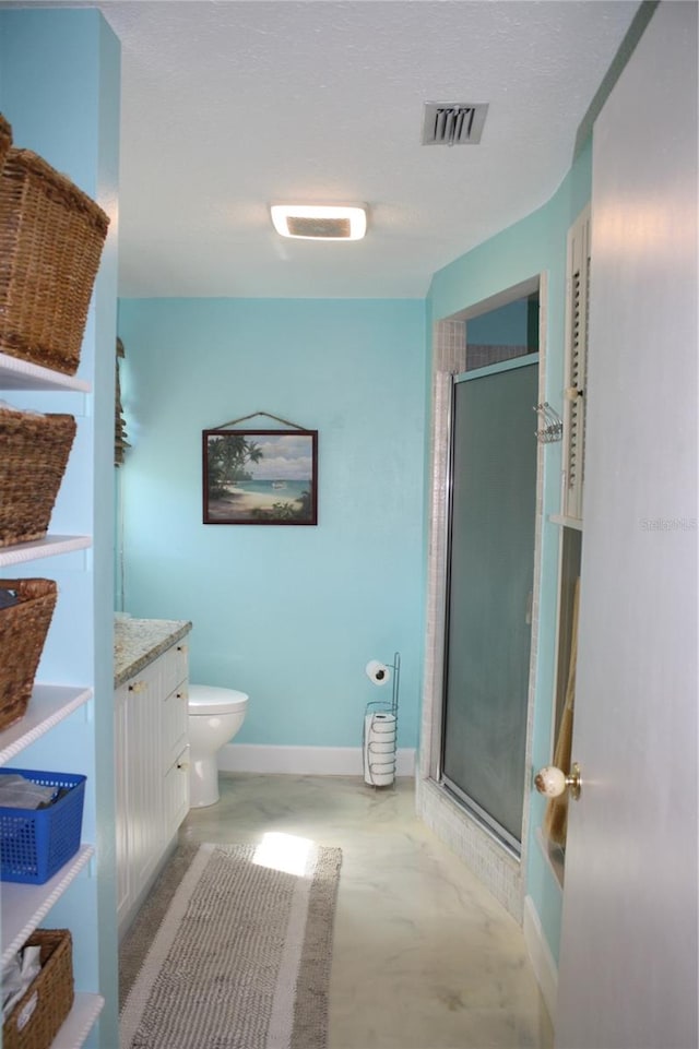 bathroom featuring toilet, vanity, an enclosed shower, and concrete flooring