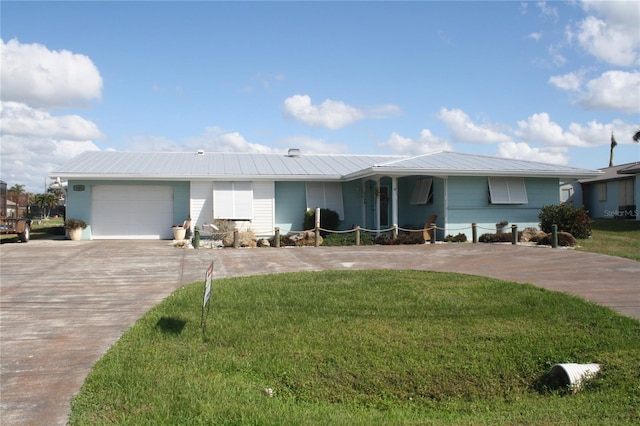 ranch-style home featuring a garage and a front yard