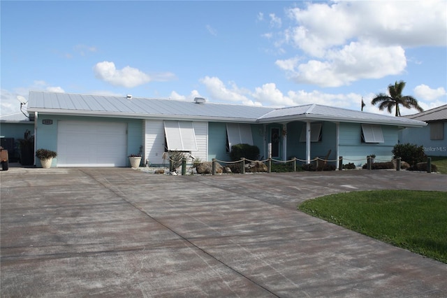 single story home featuring a garage