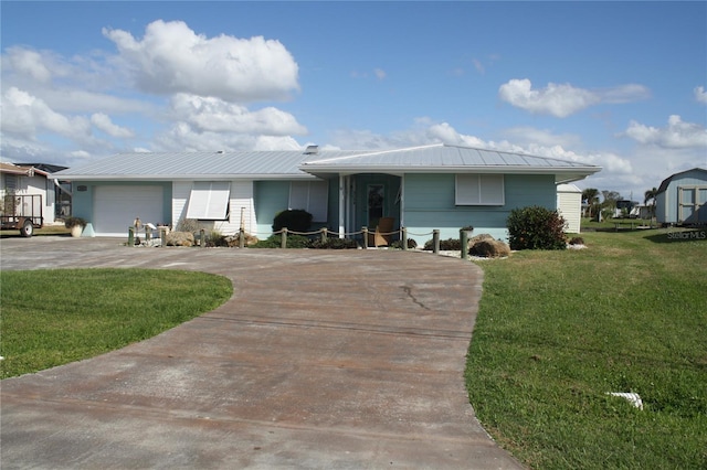 ranch-style home with a garage and a front lawn