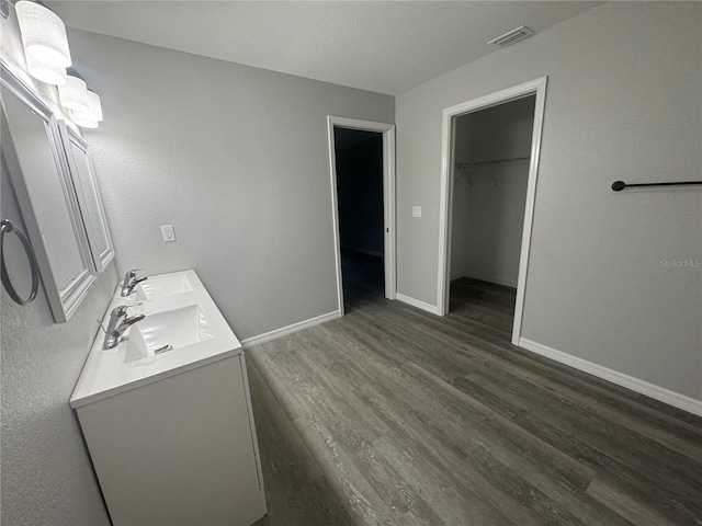 bathroom featuring hardwood / wood-style floors and vanity