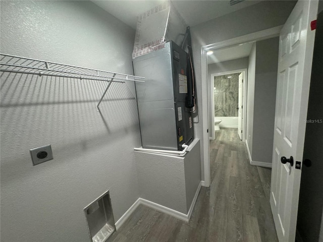 washroom featuring hookup for an electric dryer and dark hardwood / wood-style floors