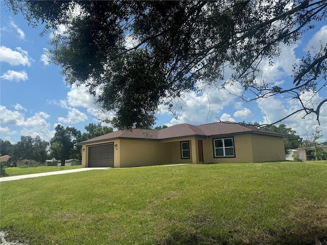 ranch-style house with a garage and a front yard