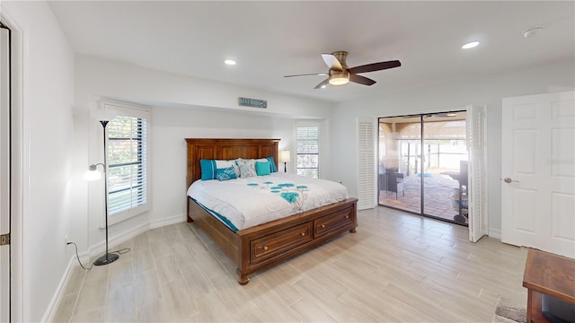 bedroom featuring light hardwood / wood-style flooring, ceiling fan, and access to exterior