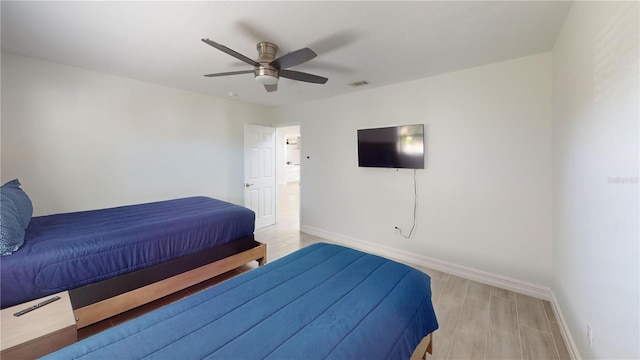 bedroom featuring ceiling fan and light hardwood / wood-style flooring