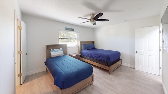 bedroom featuring light hardwood / wood-style flooring and ceiling fan