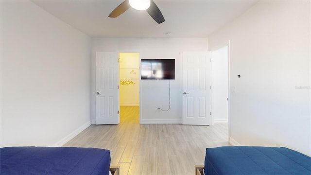 bedroom featuring ceiling fan and light hardwood / wood-style flooring