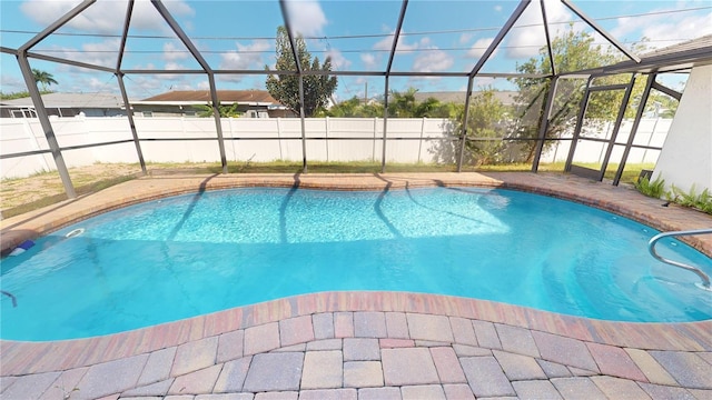 view of pool featuring a lanai