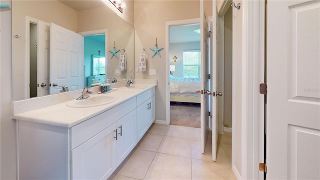 bathroom with tile patterned floors and vanity