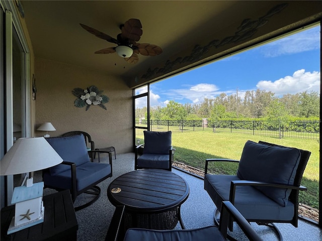 sunroom / solarium with ceiling fan