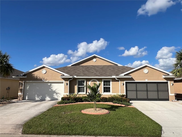 ranch-style house featuring a front yard and a garage