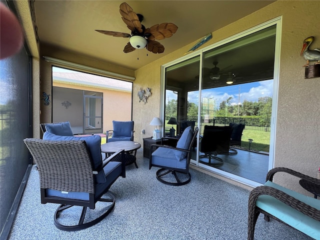 view of patio / terrace featuring ceiling fan and an outdoor living space