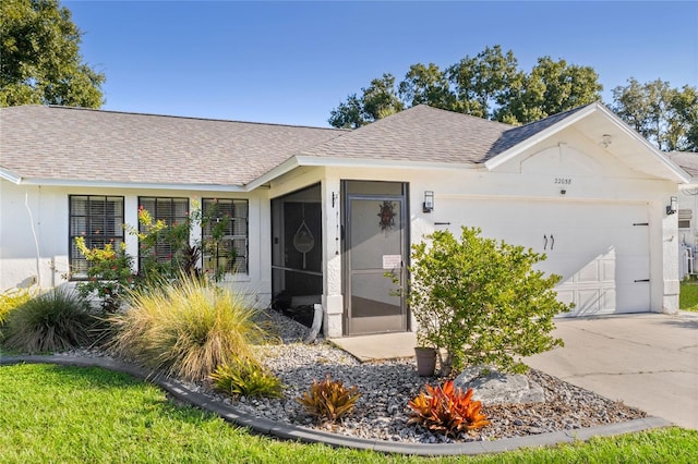 ranch-style house featuring a garage