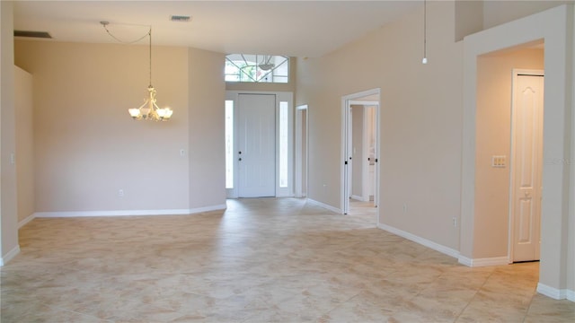 entryway featuring a chandelier