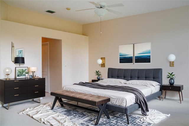 bedroom featuring light carpet and ceiling fan